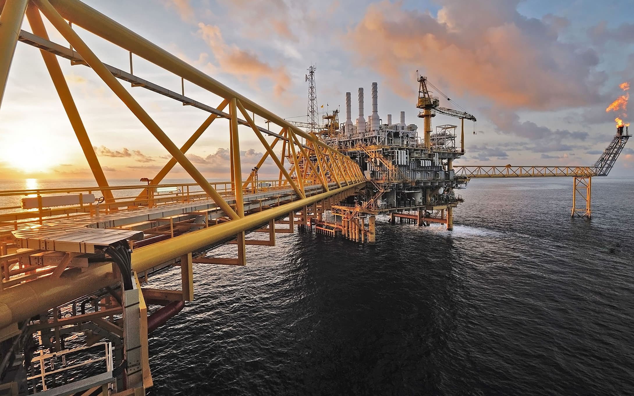 An offshore oil and gas platform operating in the ocean.